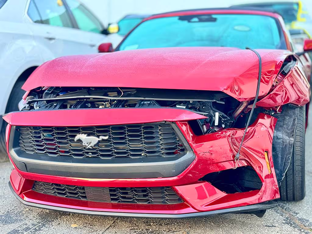 Ford Mustang front-end collision damage.